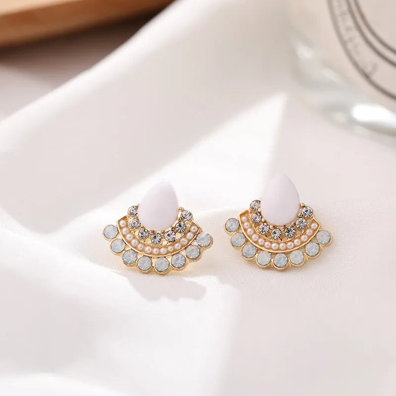 Women's retro silver-tone fan-shaped geometric drop earrings with rhinestone details on a stud post.