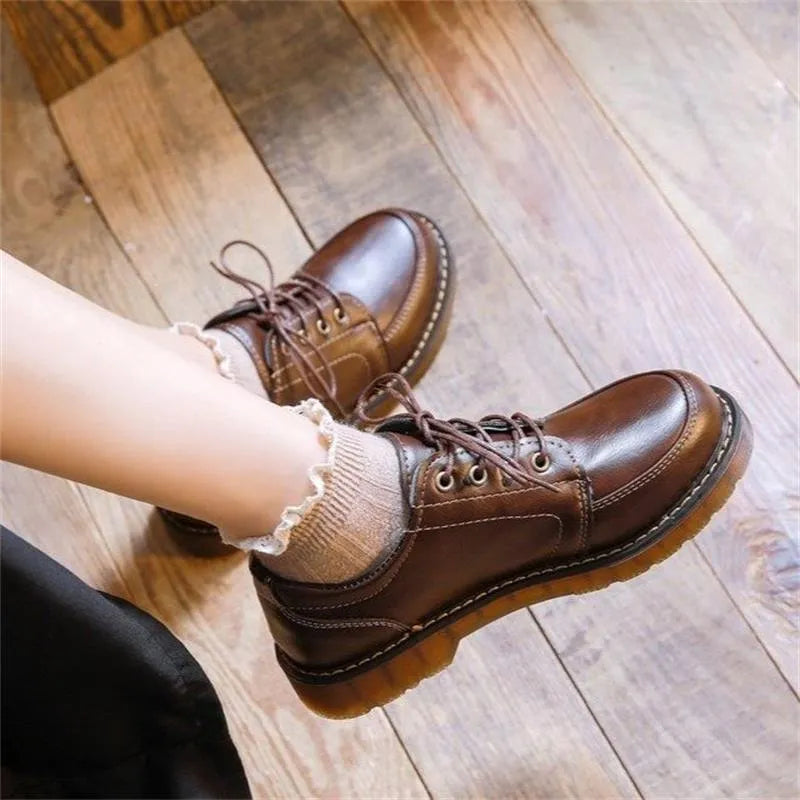 Women's black preppy retro Mary Jane shoes with round toe and front lace-up.