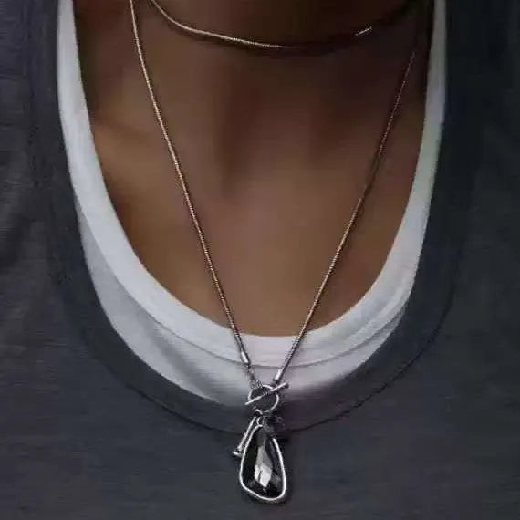 Women's long geometric alloy pendant necklace with snake bone chain, showing blue water drop colour option.
