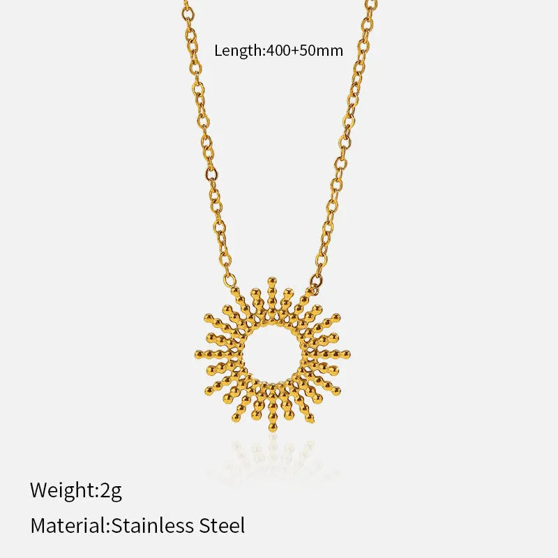 Gold geometric chain necklace and bracelet set for women on a plain background.
