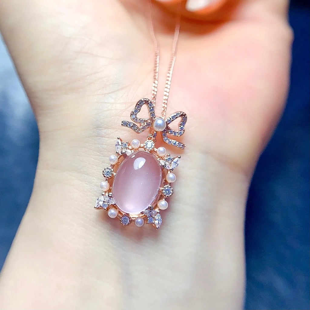 Natural pink rose quartz geometric pendant on a rose gold plated sterling silver necklace.
