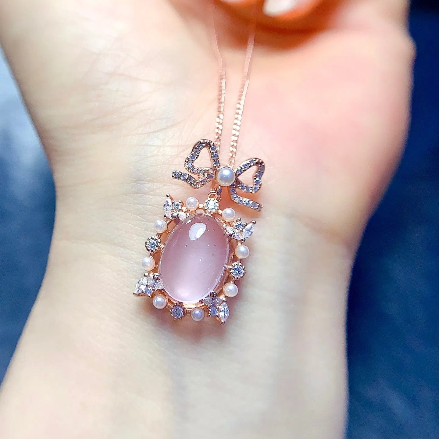 Natural pink rose quartz geometric pendant on a rose gold plated sterling silver necklace.
