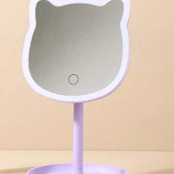 Pink rechargeable makeup mirror with fill light on a desk, ABS frame, aluminium mirror, size 14cm x 18cm