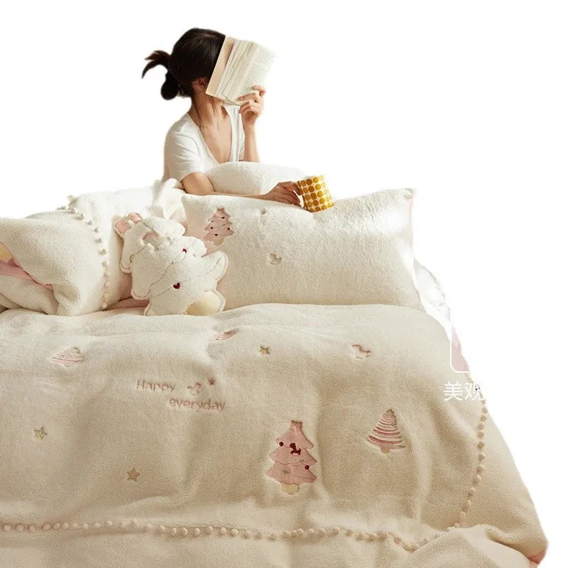 Milk fibre four-piece bedding set with green Christmas tree pattern on a duvet cover and pillowcases.