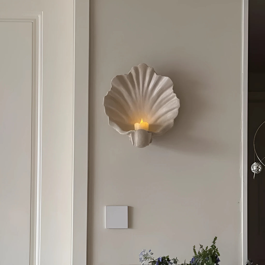 White resin fruit plate ornament shaped like a shell on a table