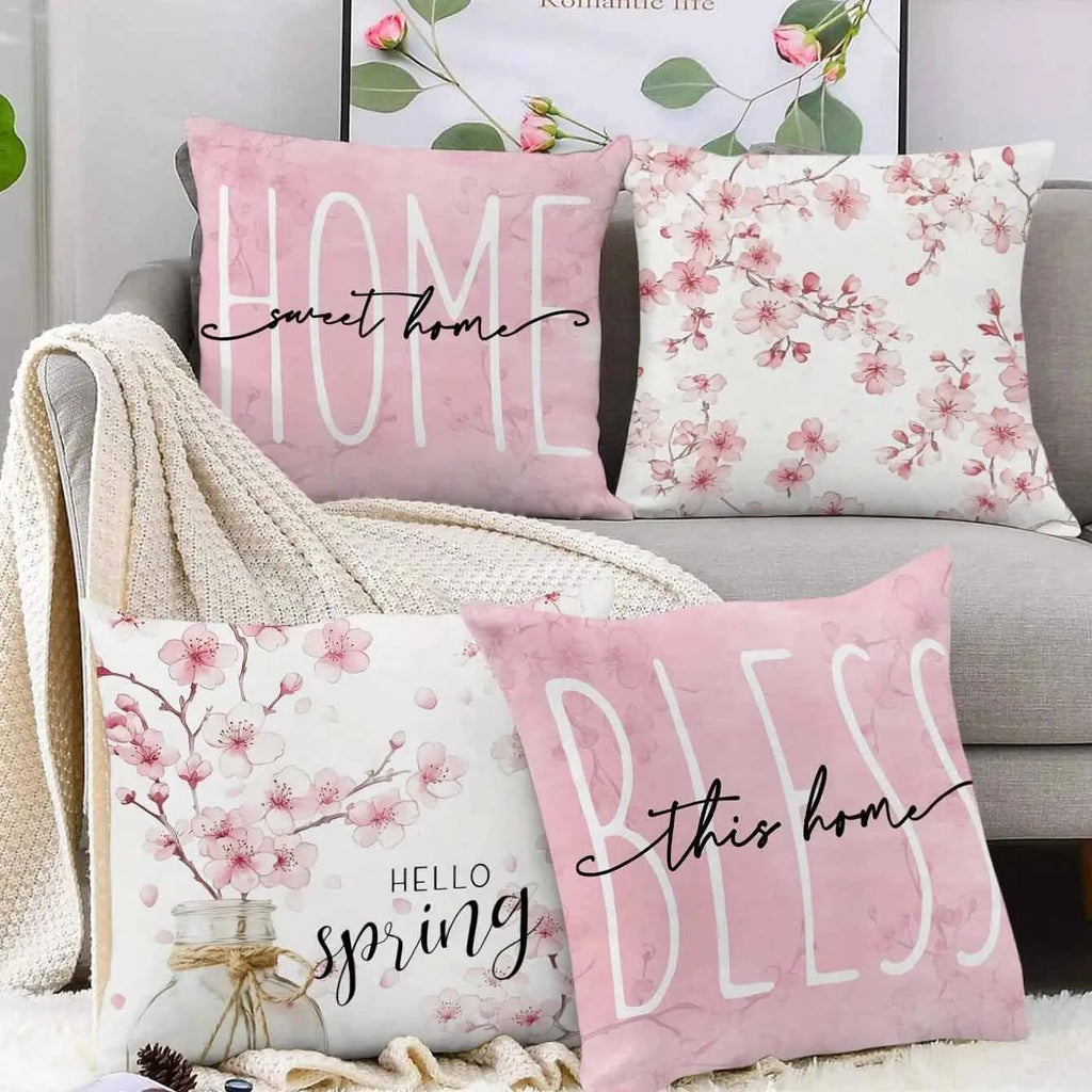 Short velvet cushion cover with cherry blossom letter design, 45cm square, shown in one of four colour options.