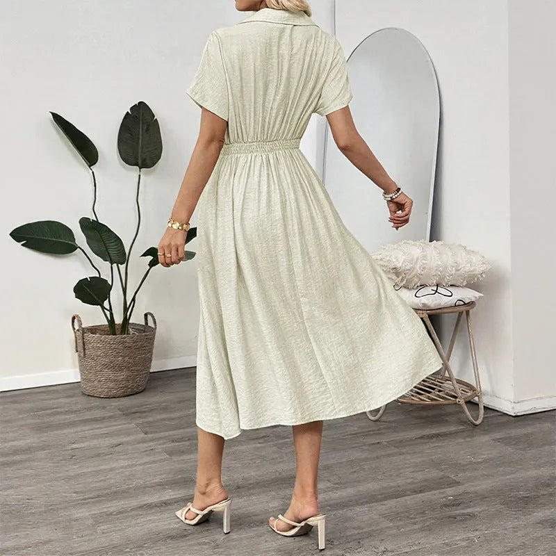 Light green commuter shirt dress with lapel collar, waist tie, and side pockets on a hanger.