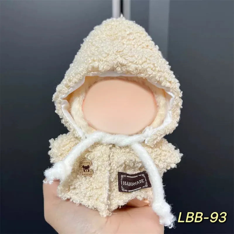 Plastic clothing outfit for a 17cm tall vinyl figure or doll on a display stand.
