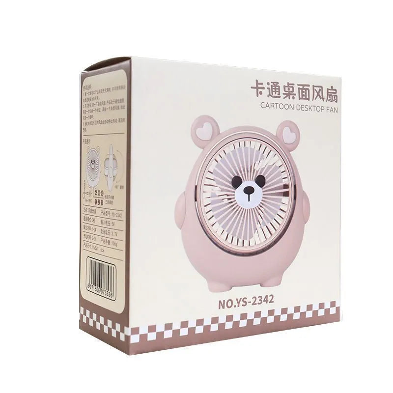 Cute dog-shaped desktop USB fan in a choice of colours on a wooden desk.