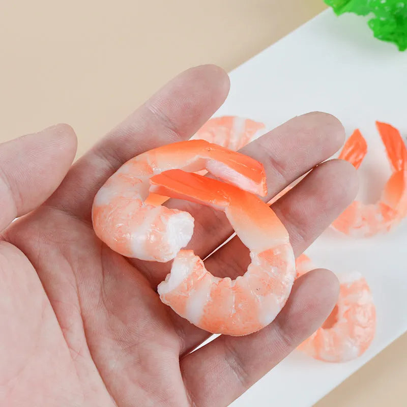 PVC injection moulded shrimp-shaped keychain with door buckle function, shown in modern simplicity style.