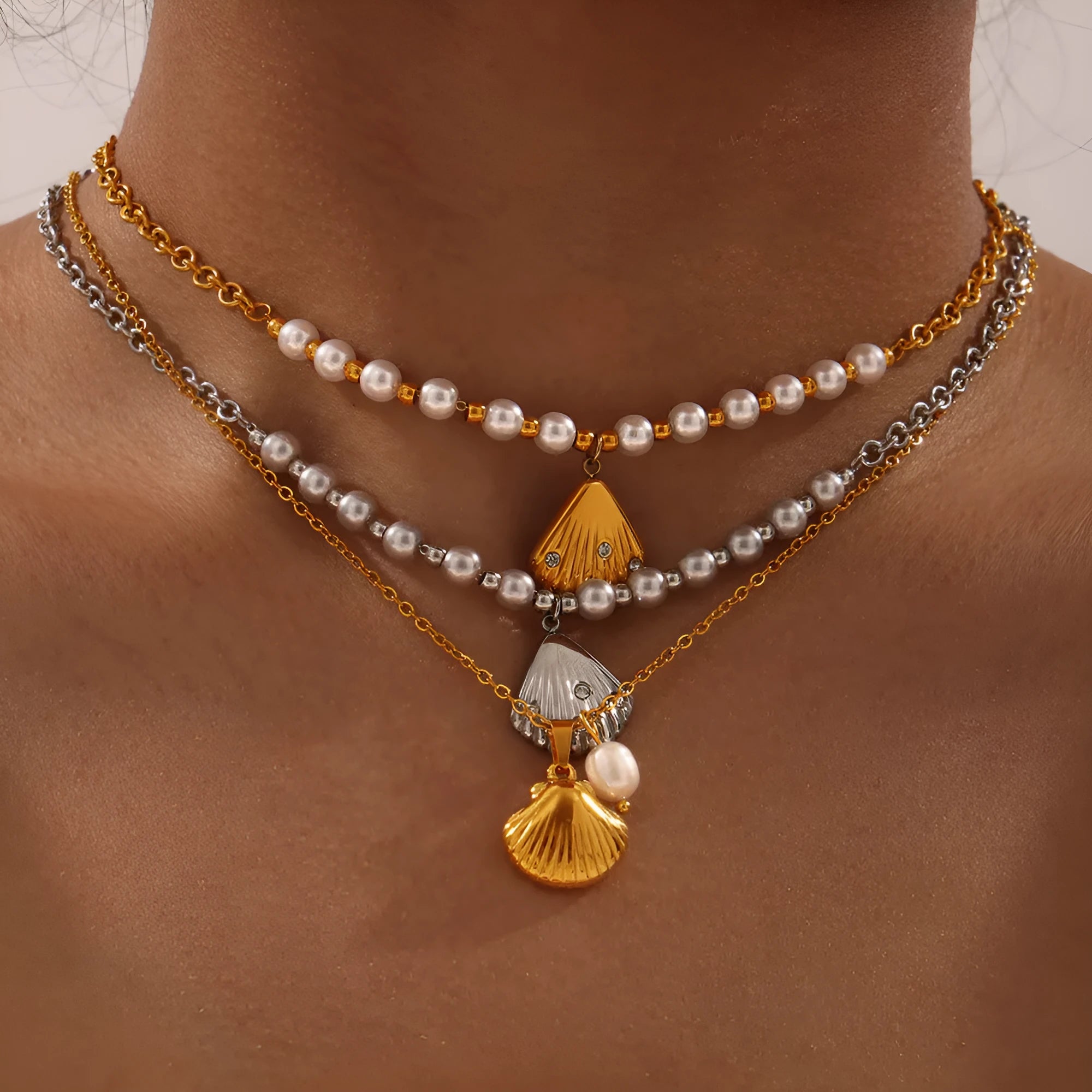 Women's titanium steel necklace with freshwater pearl beads and French vintage shell pendant.