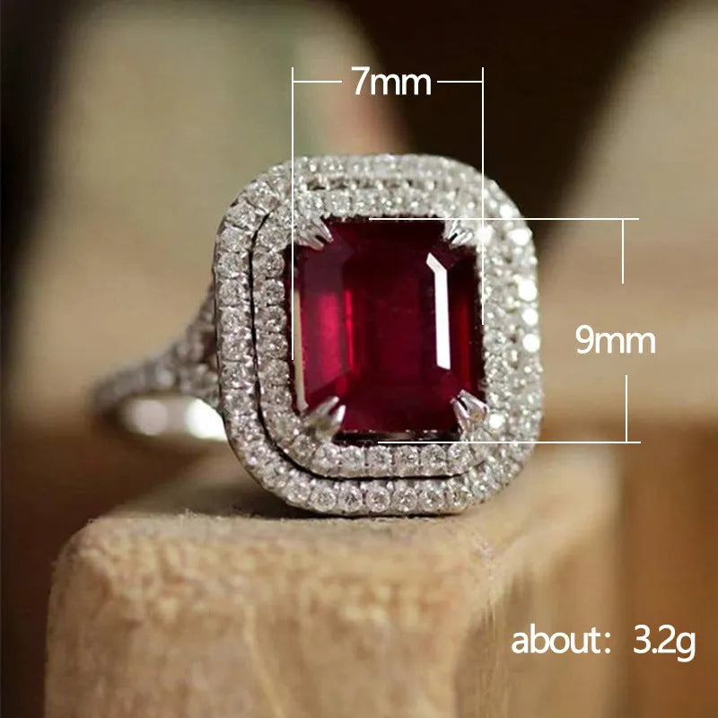 Women's square copper ring with a large red rhinestone set in a geometric princess style.