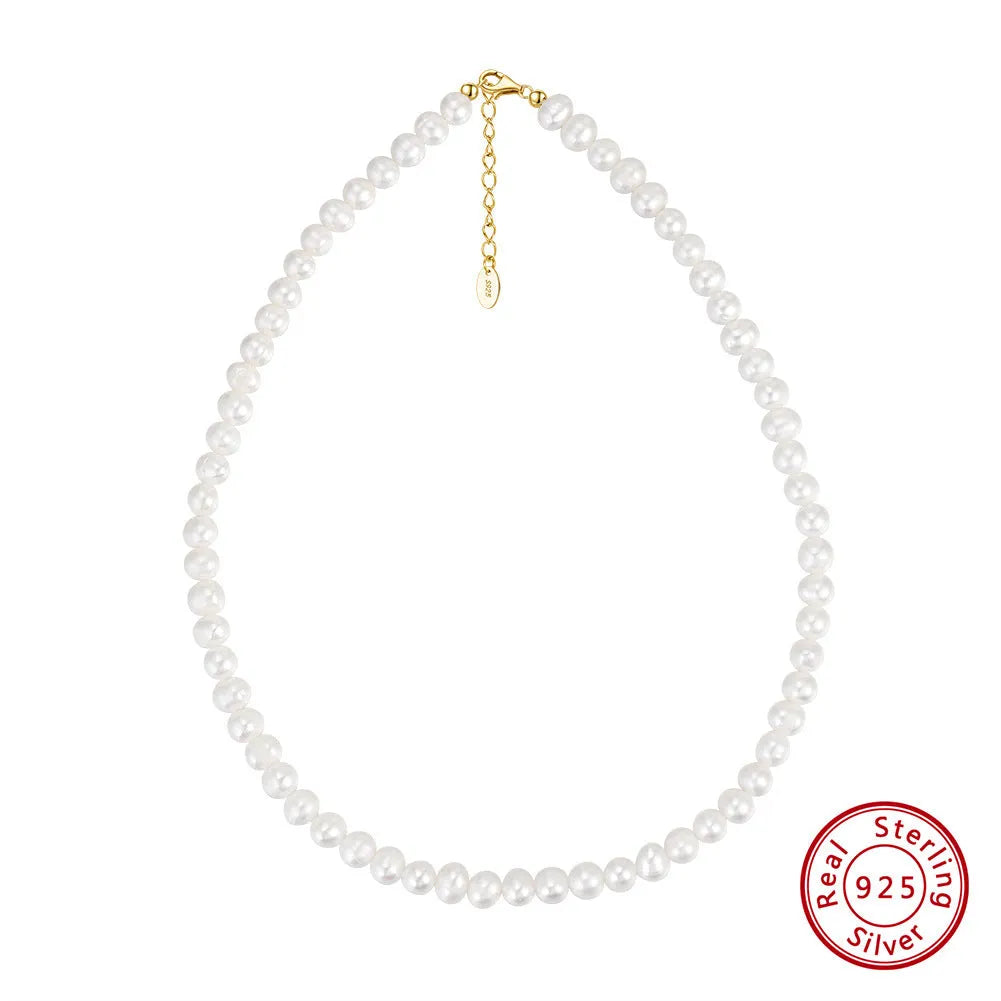 Women's adjustable necklace with natural freshwater pearls on a sterling silver chain.