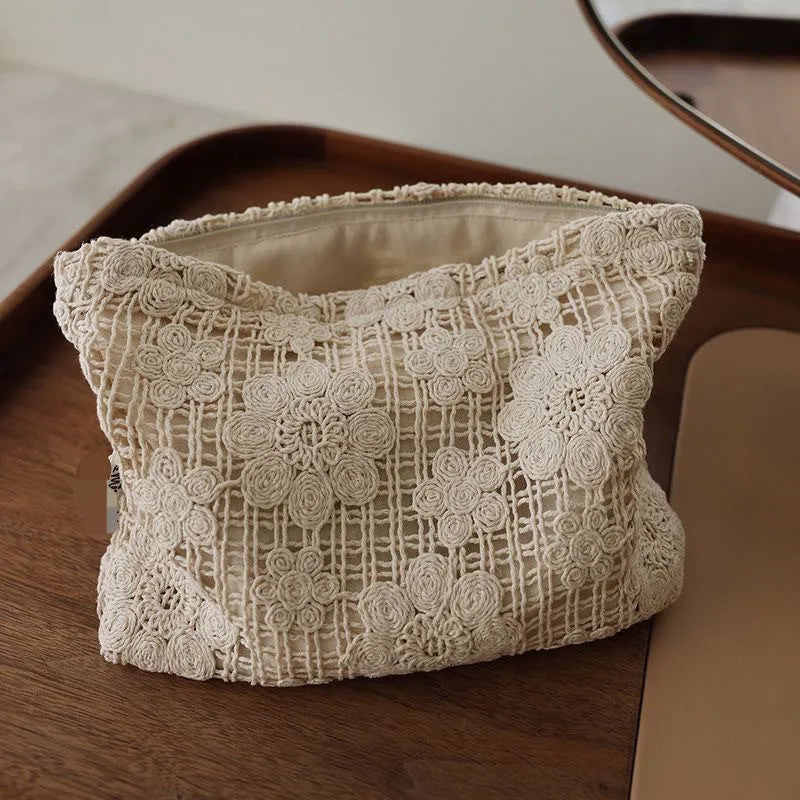 Handmade crocheted hollow flower cosmetic bag with ethnic embroidery patterns on corduroy fabric