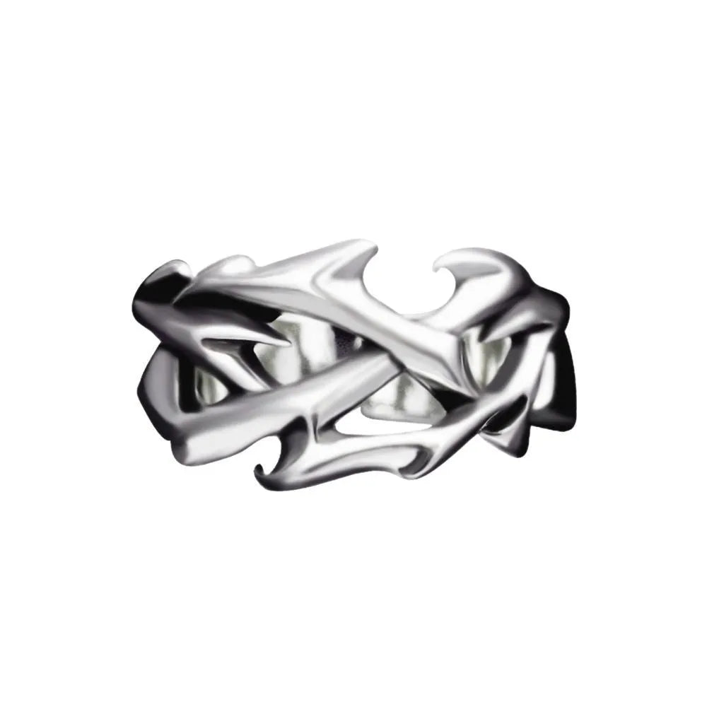 Copper geometric thorn and flower design ring with an adjustable opening on a dark background.