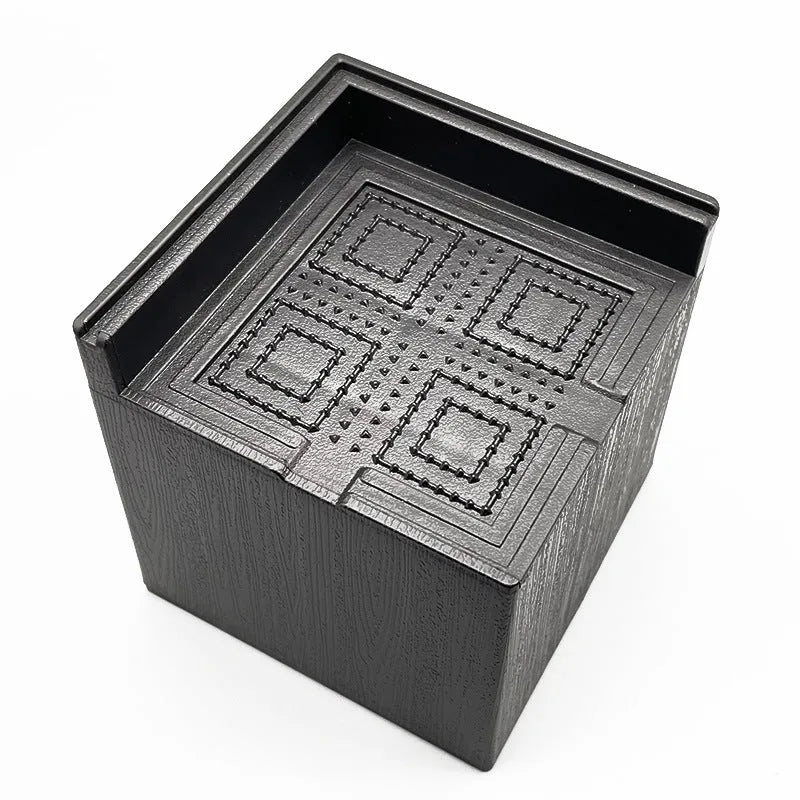 Black plastic furniture height adjustment mats in four-piece set for bed and sofa feet