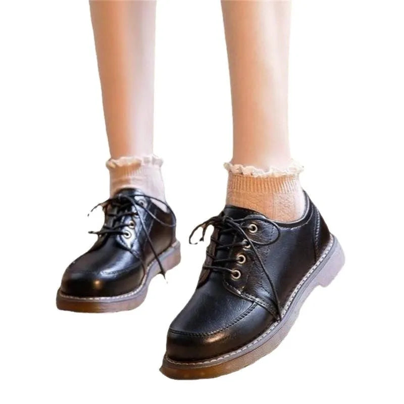 Women's black preppy retro Mary Jane shoes with round toe and front lace-up.