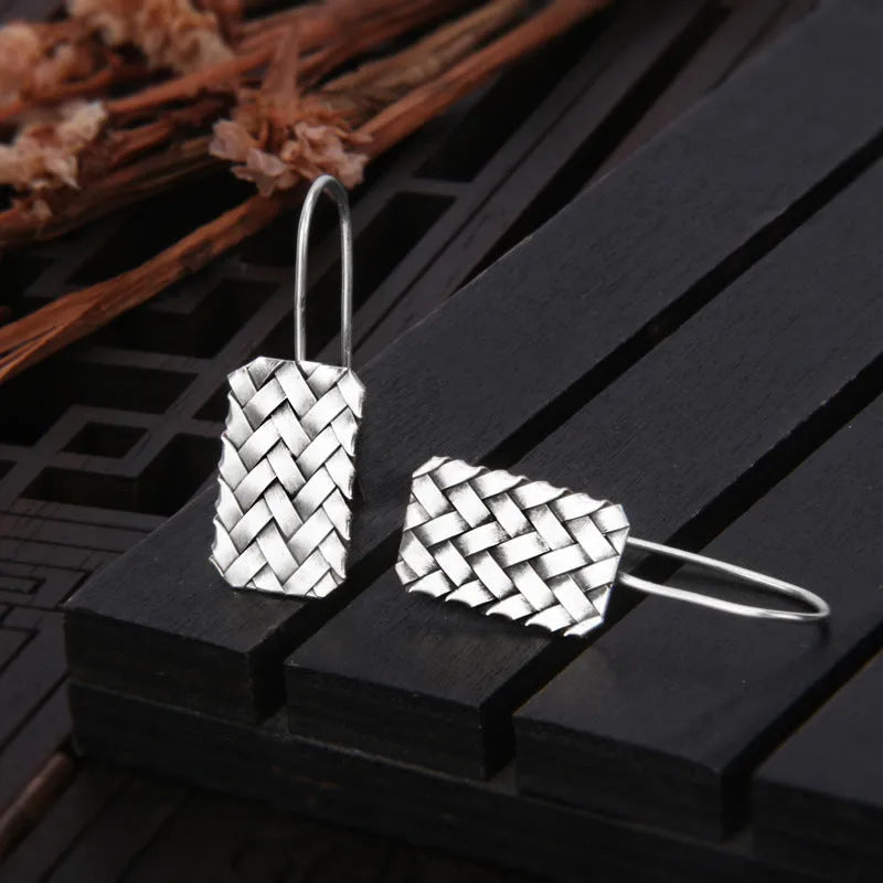 Geometric diamond plaid woven earrings in sterling silver measuring 17.5mm by 11mm
