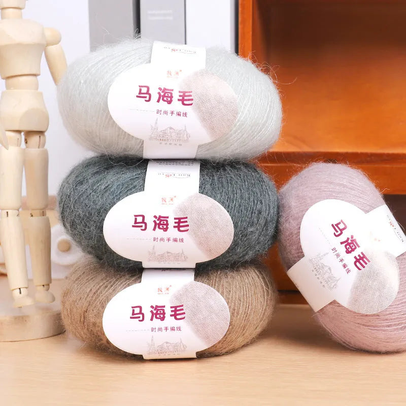 A ball of mohair wool for DIY hand-weaving a scarf in the Inverness thread style, with 34 colour options.