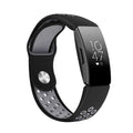 Two-colour breathable hole silicone watch strap in black and gray on a white background