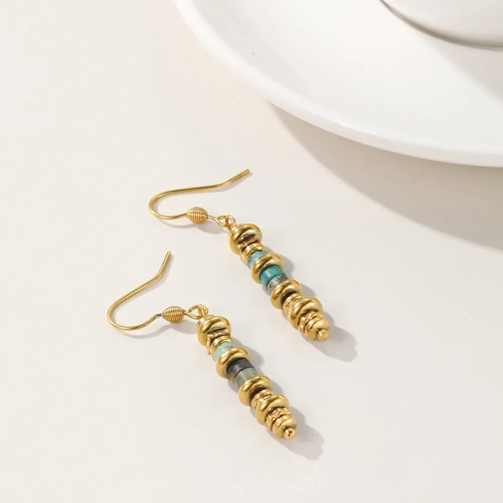 Titanium steel geometric dangle earrings in a retro style with an 18K plated finish.