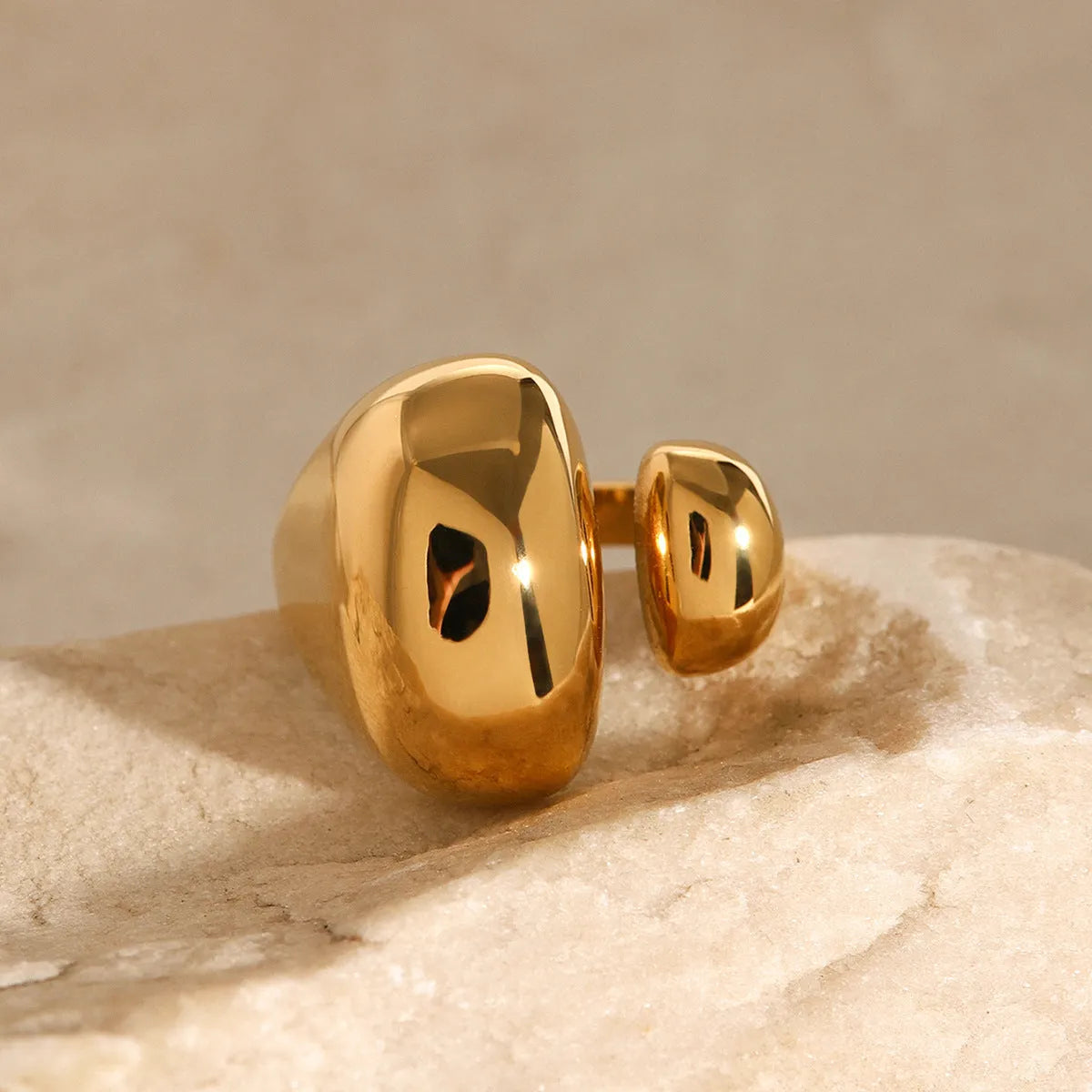 Stainless steel geometric open ring with electroplated metallic finish