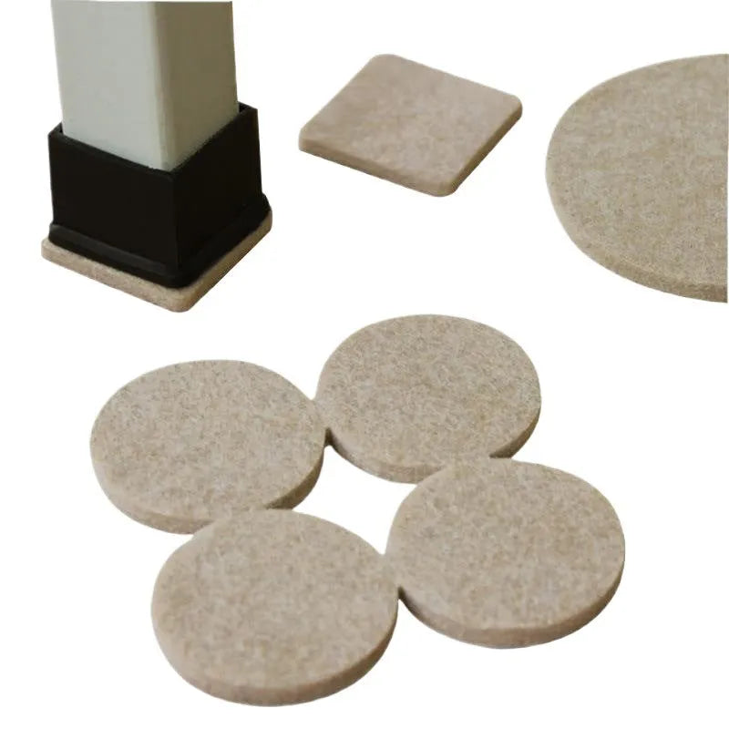 Assortment of beige round and square plastic non-slip furniture foot pads on a wooden floor.