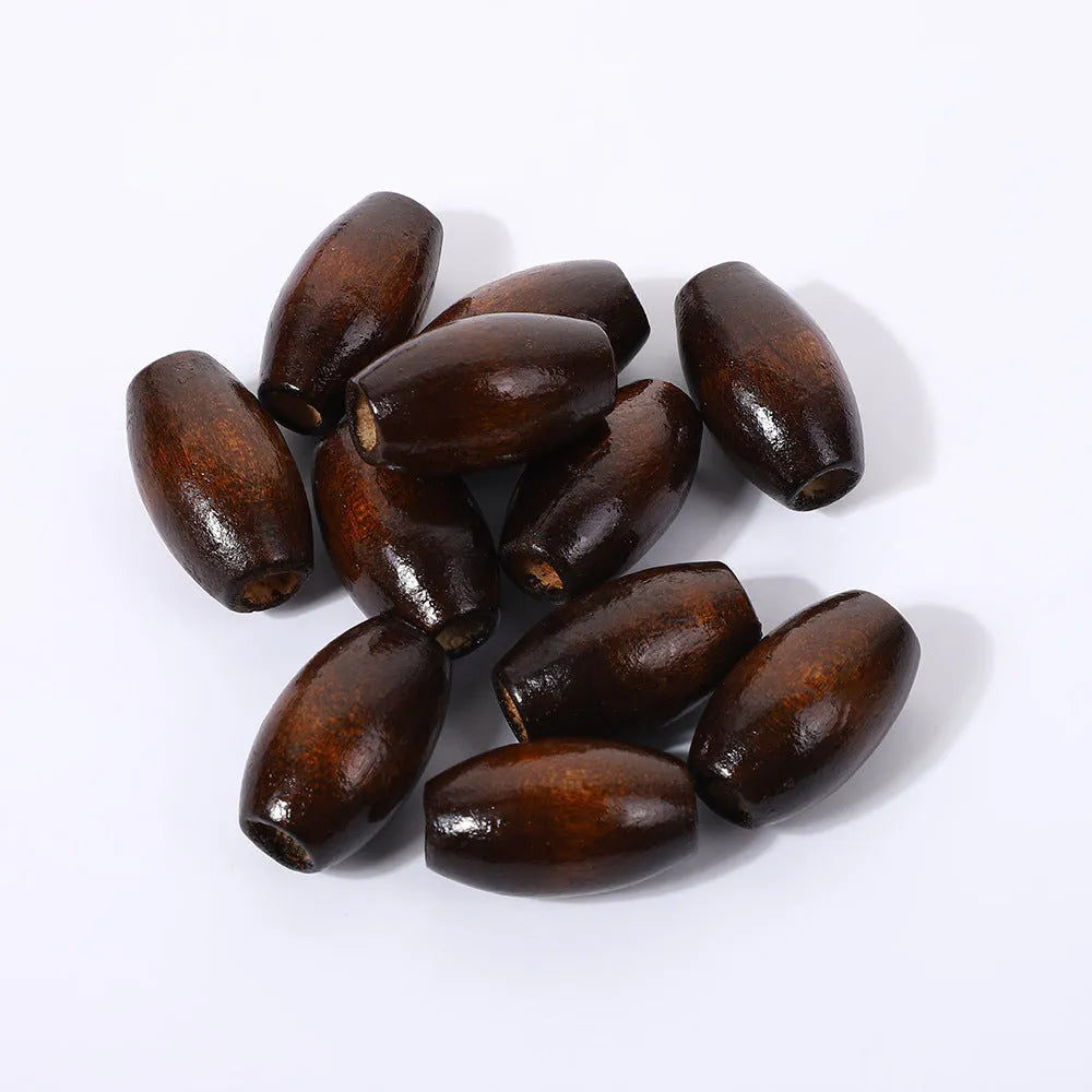 Dark coffee coloured oval wooden bead with M-shaped raised design, 25mm size