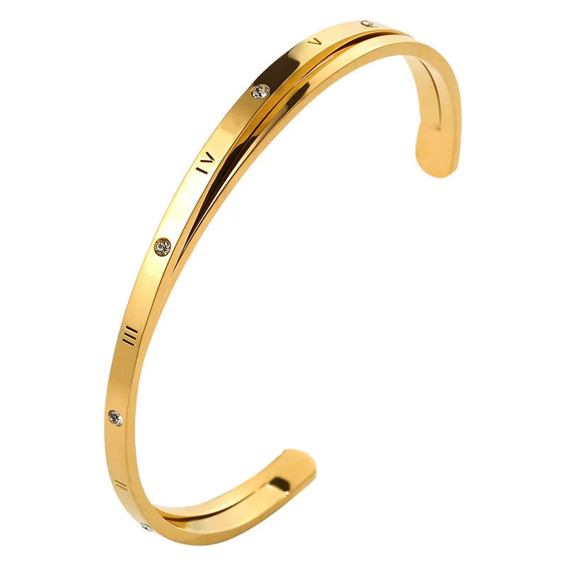 Women's stainless steel open-ended bracelet with inlaid zircon stones in gold colour.