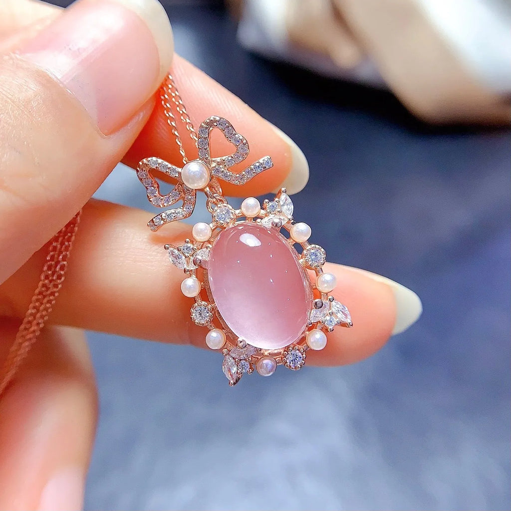 Natural pink rose quartz geometric pendant on a rose gold plated sterling silver necklace.