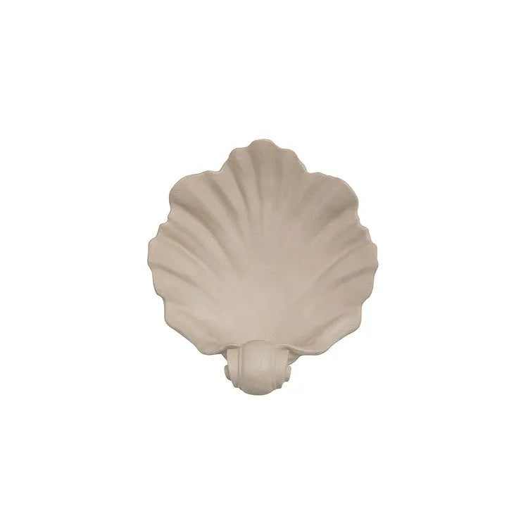 White resin fruit plate ornament shaped like a shell on a table