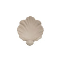 White resin fruit plate ornament shaped like a shell on a table