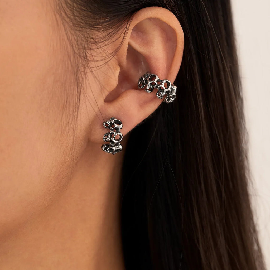 Stainless steel skull ear clip earrings with geometric hollow design and electroplated finish