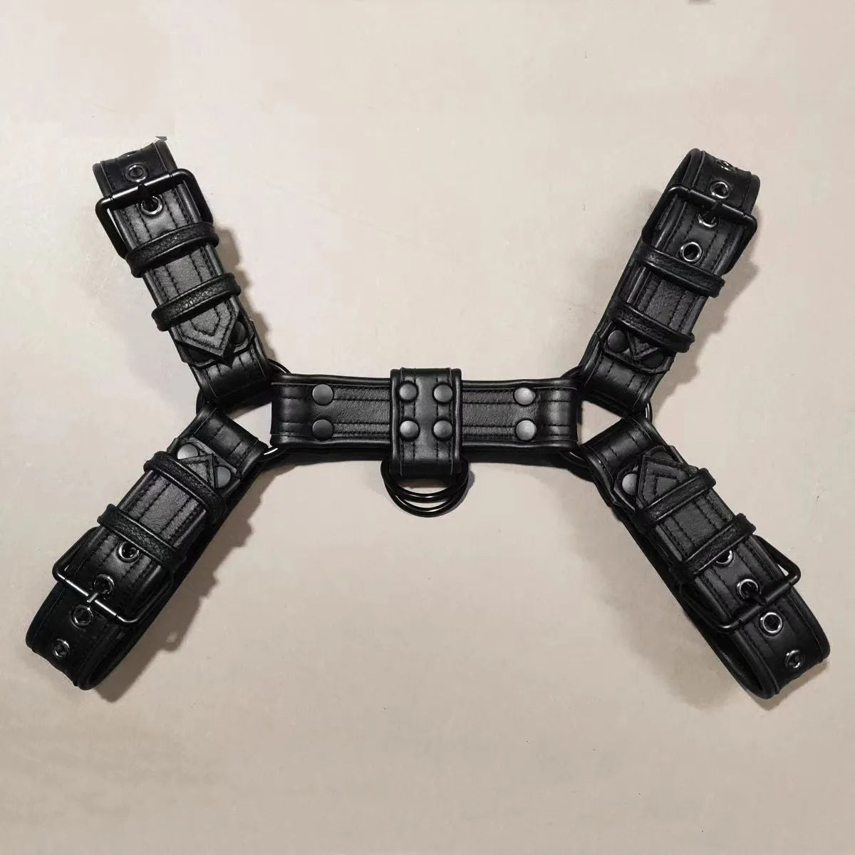 Black leather chest muscle bondage strap with metal buckle fastening system
