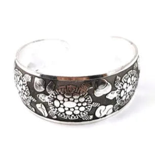 Miao ethnic silver-style bracelet with carved open design in alloy construction