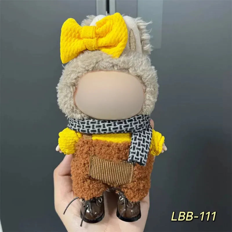 Plastic clothing outfit for a 17cm tall vinyl figure or doll on a display stand.