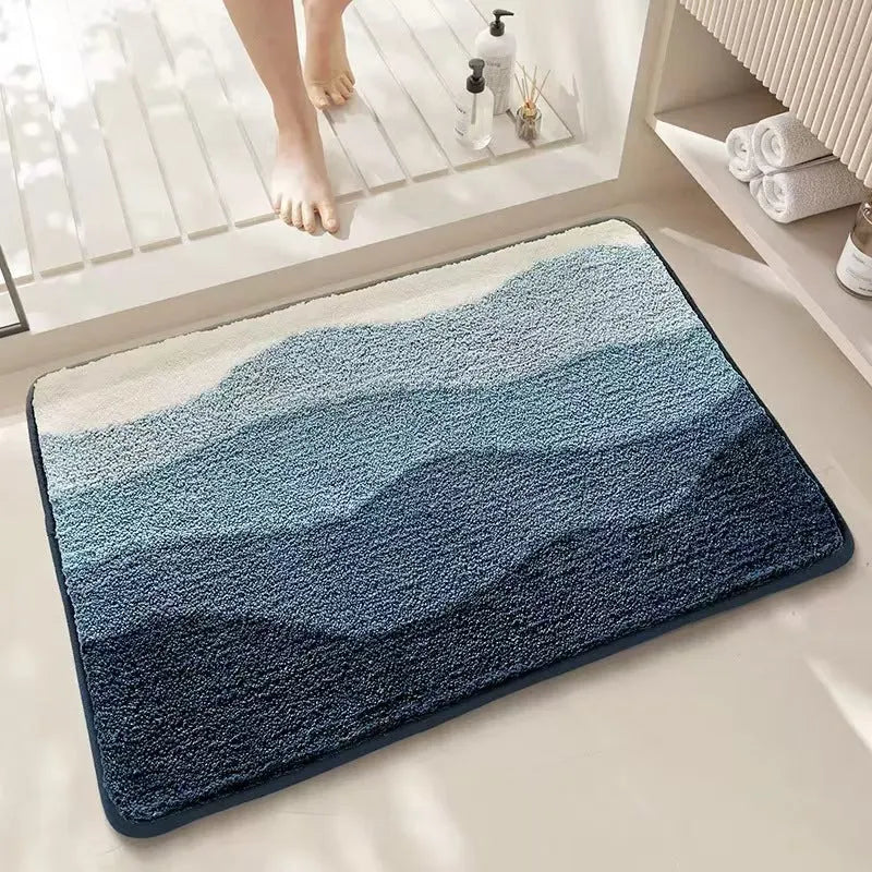 Sky and Sea rainbow print floor mat with anti-slip plastic backing on a wooden floor.