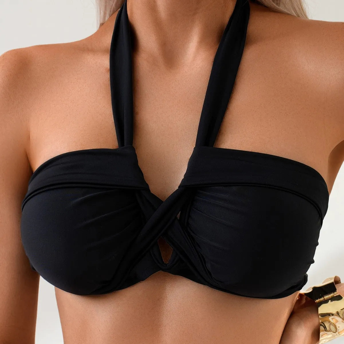Black backless women's bikini swimsuit made from polyester fabric.