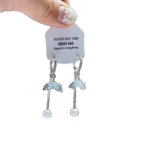 Geometric silver-tone alloy ear clips with rhinestones and hanging tassels, showing heart-shaped details