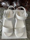 Women's beige peep toe platform sandals with an ankle-strap buckle on a white background