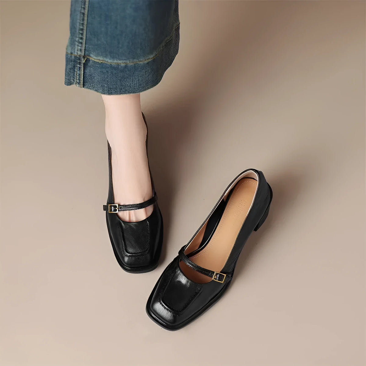 Women's black retro square toe soft high heel pumps with buckle closure on a neutral background