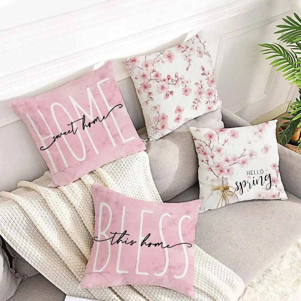Short velvet cushion cover with cherry blossom letter design, 45cm square, shown in one of four colour options.