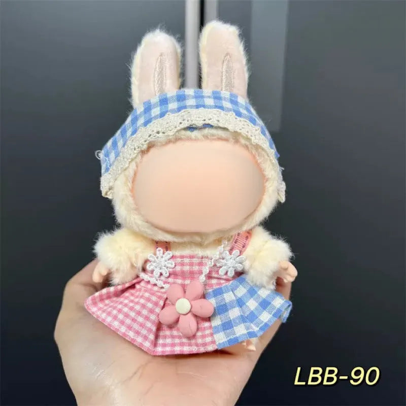 Plastic clothing outfit for a 17cm tall vinyl figure or doll on a display stand.