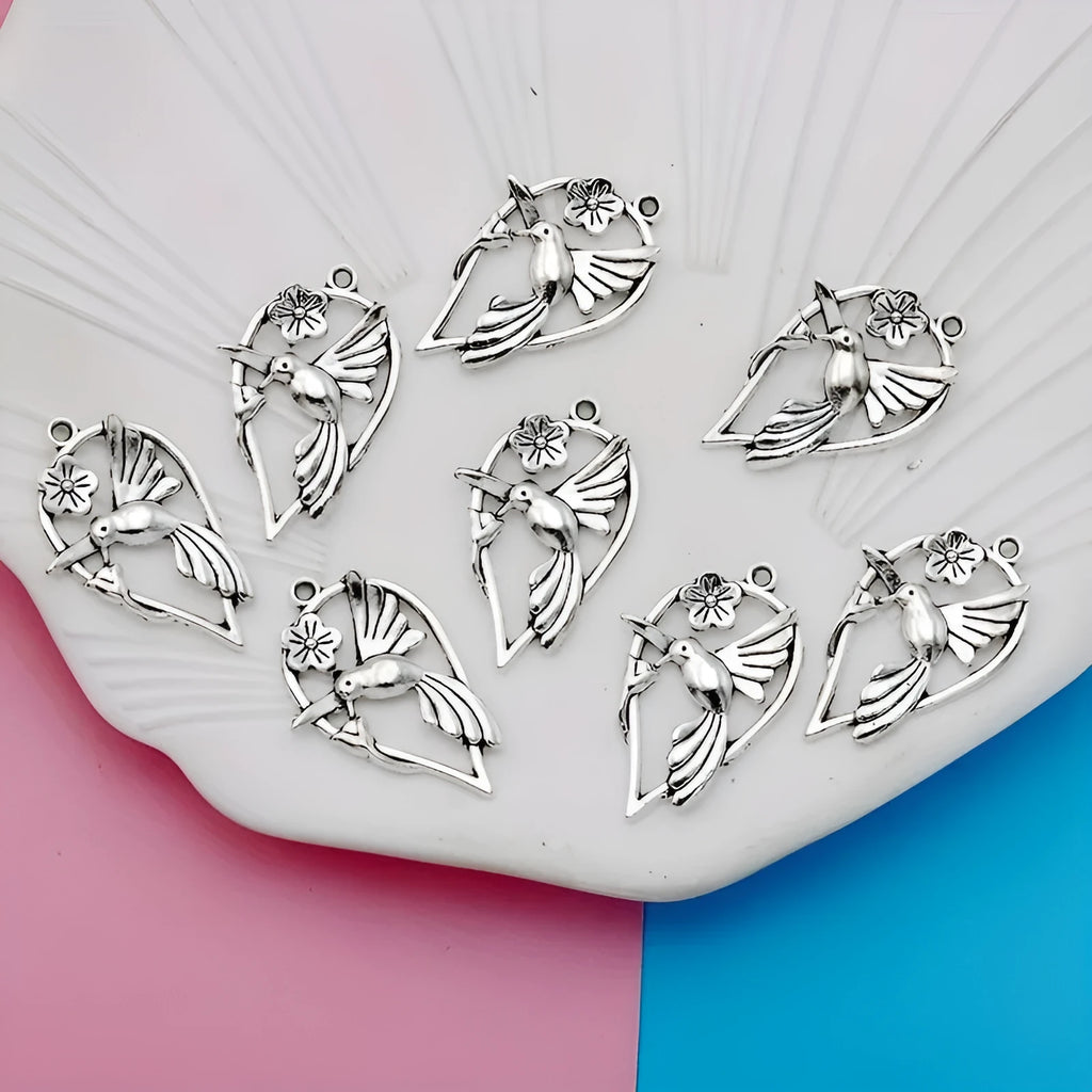 Silver-toned alloy DIY pendant with detailed magpie pattern, shown against a plain background.