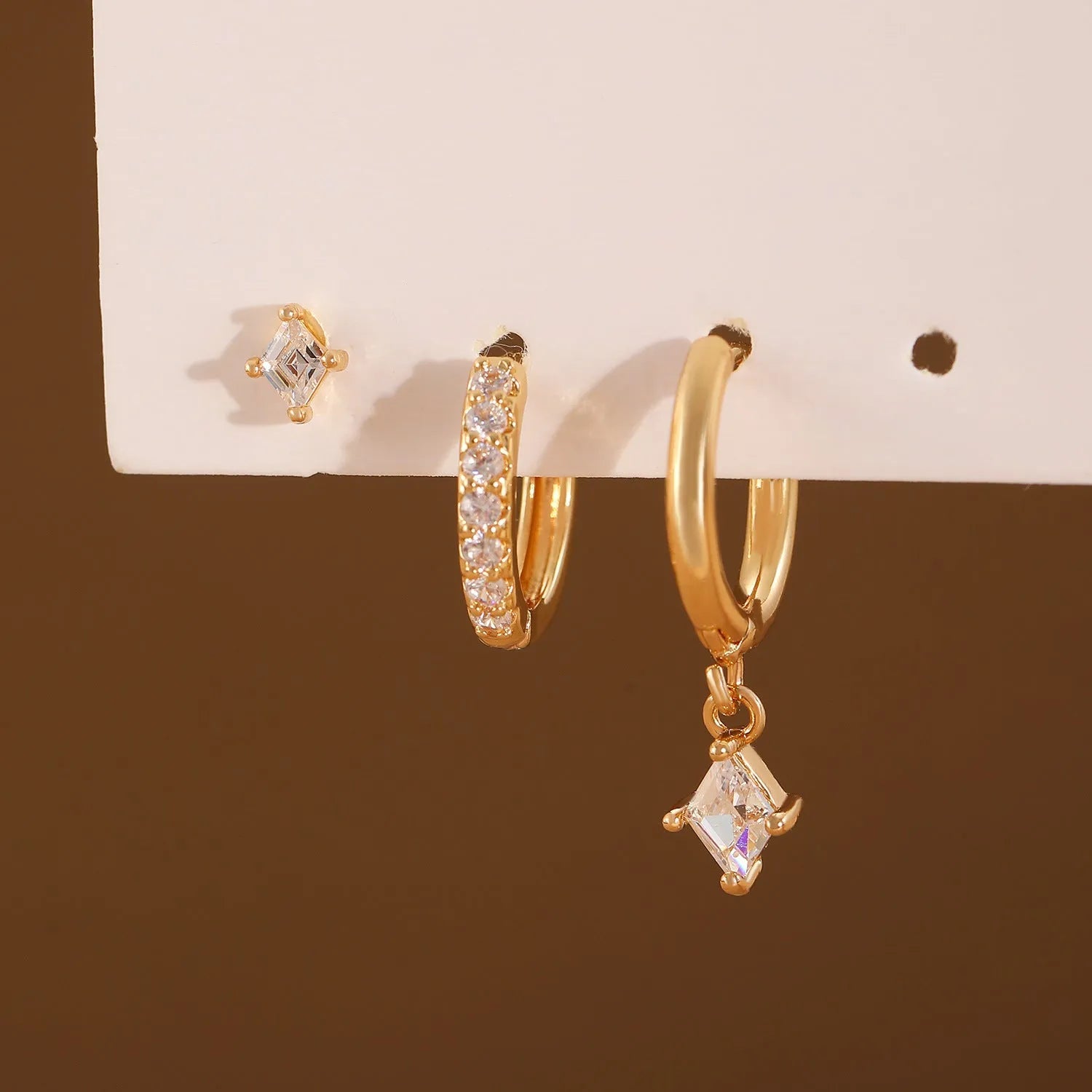 Geometric ladies earring set with zircon detailing in gold and white colours