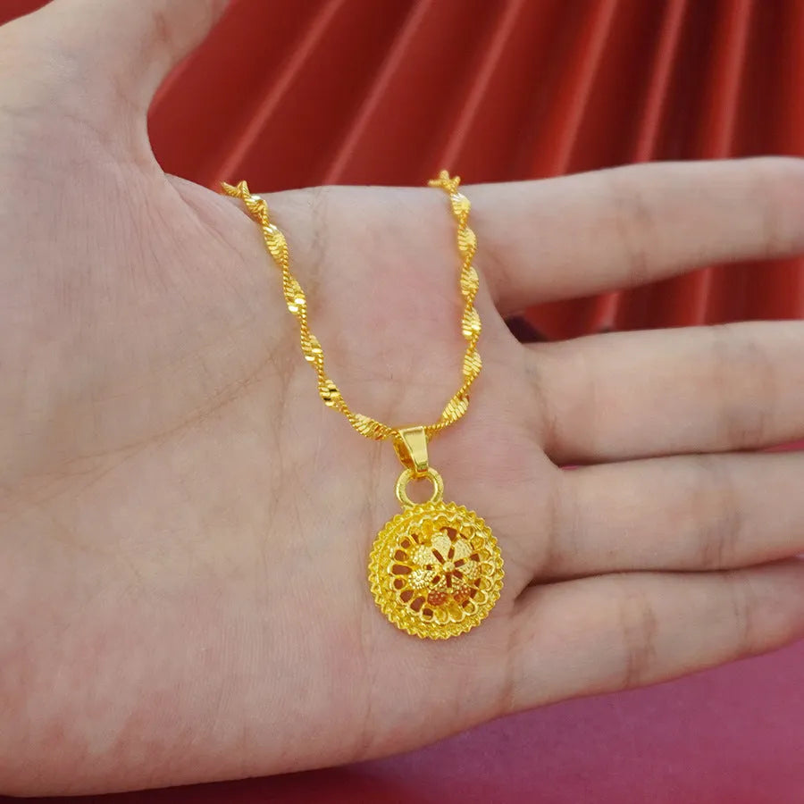 Gold-plated three-piece jewellery set with floral designs showing necklace, earrings, and ring