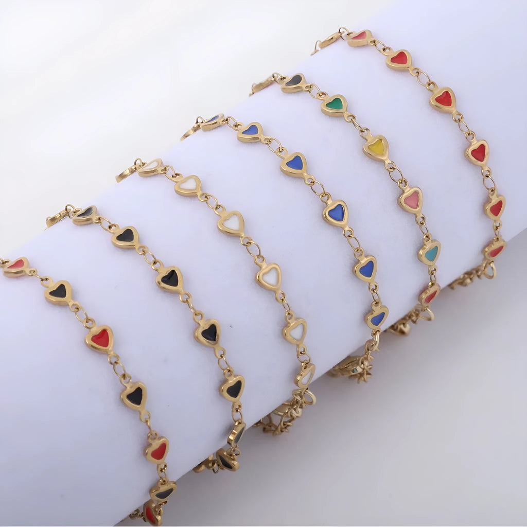 Stainless steel adjustable bracelet with a heart-shaped charm, shown in one of six colour finishes including black, blue, or red.