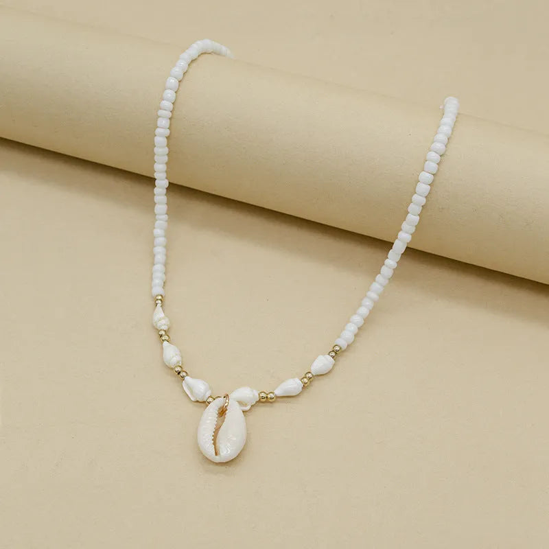 White conch bead necklace with mother pearl shellfish pendant on regular chain