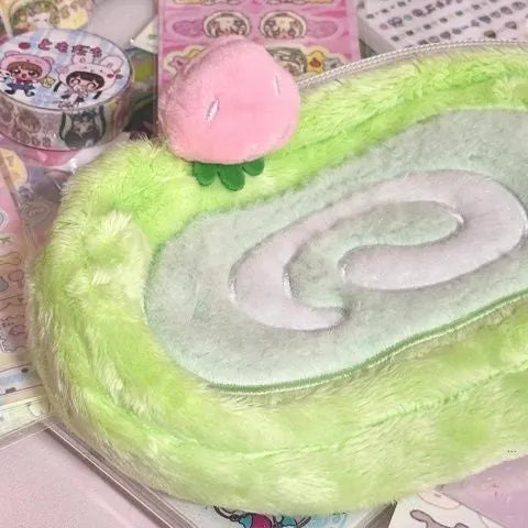 Honeydew Roll plush velvet Swiss roll cake design pencil case for stationery storage.