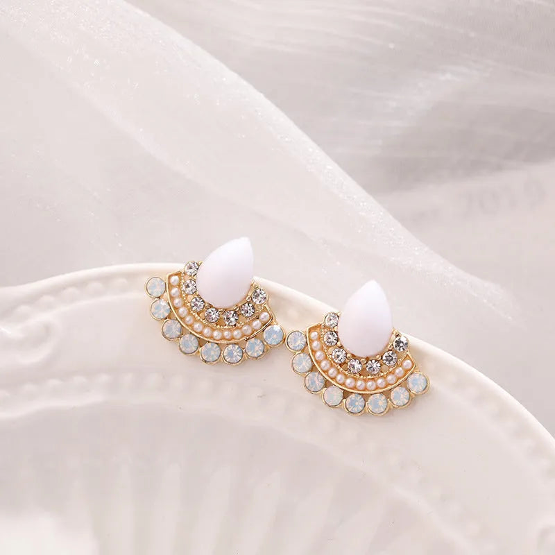 Women's retro silver-tone fan-shaped geometric drop earrings with rhinestone details on a stud post.